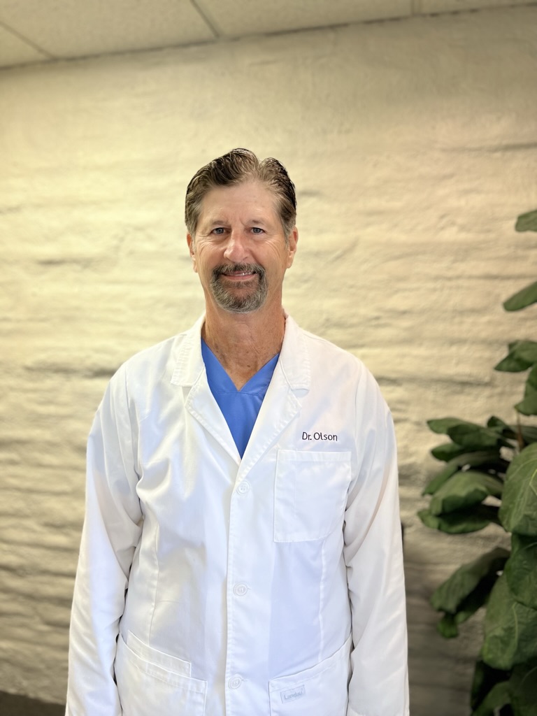 Dr. John Olson, DDS, in his Huntington Beach dental office
